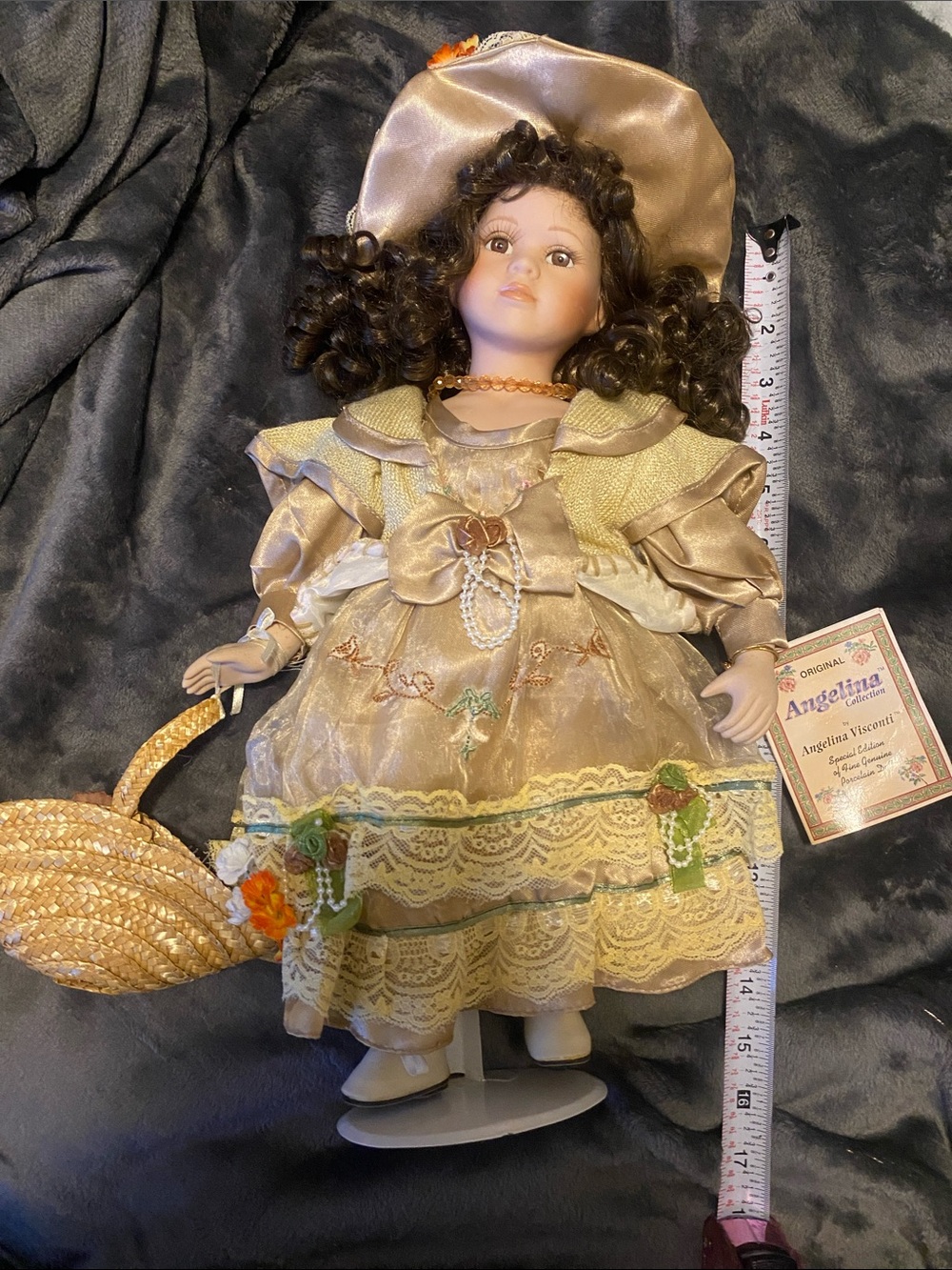 Angelina Porcelain Doll in Shimmery Gold Dress with Straw Basket